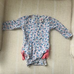 Ruffle Butts Floral Long Sleeve Baby Romper with Pink Tassels